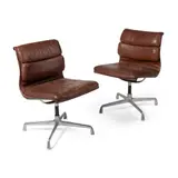 Pair of Soft Pad Chairs by Charles and Ray Eames, brown leather and aluminium, sold Oct 2021