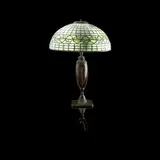 TABLE LAMP, CIRCA 1900 by Tiffany Studios, 1900, patinated bronze, sold Oct 2021