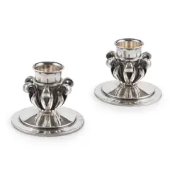 PAIR OF CANDLESTICKS, CIRCA 1930 by Oscar Gundlach-Pedersen, 1930, sterling silver, sold Oct 2021