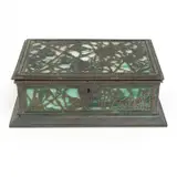 Bronze and Glass Grapevine Motif Box by Tiffany Studios, Bronze body with brown and green patina, green stained glass panels, wood lined interior, sold Jul 2024