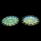 Favrile Yellow Iridescent Glass Plates, Lot of Two. by Tiffany Studios, 1910, Blown and moulded glass, with shallow fluting, alternating opalescent and plain bands radiating from center. Polished po, sold Sep 2019