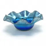 Blue Favrile Glass Bowl. by Tiffany Studios, 1900, Wavy-edged, favrile glass rim, iridescent blue to lavender bowl interior. Polished pontil, sold Sep 2019