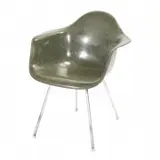 For Herman Miller DAX Armchair. by Charles and Ray Eames, 1960, Olive green molded fiberglass seat shell, on four steel tube legs with white plastic capped feet, sold Sep 2019