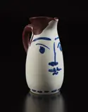 Face tankard (Chope visage) by Pablo Picasso, 1959, White earthenware turned pitcher, painted in colors with partial brushed glaze; ceramic, Madoura edition, sold Oct 2018