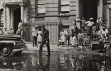 Helen Levitt, New York (NY policeman, wet street & kids), circa 1940, Gelatin silver print
