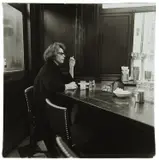 Woman at a counter smoking, N.Y.C. by Diane Arbus, 1962, Gelatin silver print, printed later by Neil Selkirk, sold Oct 2018