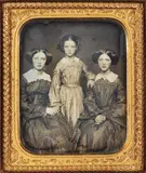 John Adams Whipple, Three Sisters, one wearing a Star of David at her neck, circa 1855, Daguerreotype, with gilt detail and hand coloring, modern seal, cased