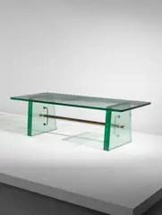 Large coffee table by Pietro Chiesa, circa 1934, Glass, brass, patinated steel, sold Jun 2018