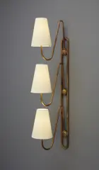"Pointe Messery" wall light by Jean Royere, circa 1955, Gilt steel, fabric shades, sold Jun 2018