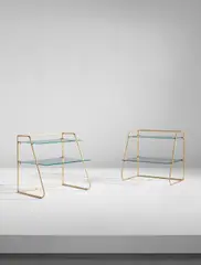 Two bedside tables by Jean Royere, circa 1955, Gilt steel, glass, sold Jun 2018