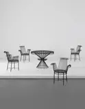 Mathieu Matégot, "Cap d'Ail" table and set of four armchairs