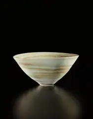 Conical bowl by Lucie Rie, 1970s, Porcelain, mixed clays producing an integral spiral, sold Jun 2018