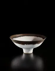 Footed bowl by Lucie Rie, 1984, Stoneware, matte white glaze with golden manganese lip, sold Jun 2018