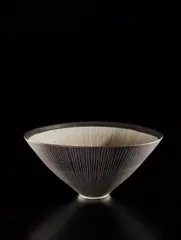 Conical bowl by Lucie Rie, 1970s, Porcelain, golden manganese glaze with sgraffito on the exterior, the interior unglazed with inlaid radiating design, sold Jun 2018
