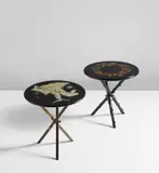 Two occasional tables by Piero Fornasetti, 1950s, Lithographic transfer-printed wood and metal, painted wood, rubber-coated steel, brass-covered wood, brass, sold Dec 2018