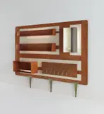 Illuminated "Parete Organizzata" by Gio Ponti, circa 1955, Brazilian rosewood-veneered wood, painted wood, painted metal, glass, brass, sold Dec 2018
