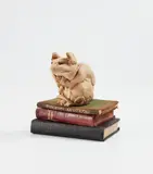 Stephanie Quayle, Vole, 2016, rich toasted stoneware and books, in 4 parts