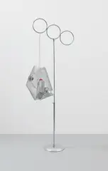 Josephine Meckseper, Mobile 5000, 2010, mirrored disco ball, plastic motor oil bottle, wire mesh and metal chain on chrome display stand