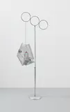 Josephine Meckseper, Mobile 5000, 2010, mirrored disco ball, plastic motor oil bottle, wire mesh and metal chain on chrome display stand