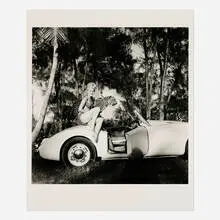 Bunny Yeager, Elaina Lekas with Her Pet Leopard Nero Seated on MG, gelatin silver print