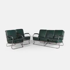 Wolfgang Hoffmann, Three-piece lounge suite, 1935, each piece with tubular chrome supports and sprung green cushions with cream piping