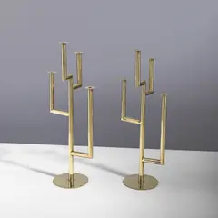 Karl Hagenauer, Paire de candélabres, An impressed pair of candelabras in brass designed by Karl Hagenauer circa 1930 and executed by Werkstätten Hagenauer Wien