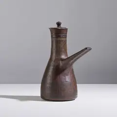 Lucie Rie, Cafetière, A coffee pot in glazed earthenware with a sgrafitto decoration by Lucie Rie circa 1960 with the artist's seal