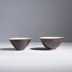 Deux bols by Lucie Rie, Two bowls in glazed stoneware by Lucie Rie circa 1958 with the artist's seal, sold Apr 2026