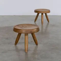 Paire de tabourets Berger by Charlotte Perriand, A pair of 'Berger' stools in oak designed by Charlotte Perriand in 1953, sold Apr 2026