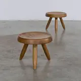 Paire de tabourets Berger by Charlotte Perriand, A pair of 'Berger' stools in oak designed by Charlotte Perriand in 1953, sold Apr 2026