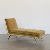 T. H. Robsjohn-Gibbings, Chaise longue, A chaise longue in lacquered sipo, brass and velvet designed by T