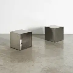 Paire de cubes formant tables d'appoint by Maria Pergay, A pair of cubes forming side tables in brushed stainless steel designed by Maria Pergay in 1968, sold Apr 2026