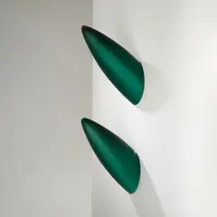Philippe Starck, Paire d'appliques Luci Fair, A pair of 'Luci Fair' sconces in opaline glass and metal designed by Philippe Starck in 1989 and edited by Flos circa 1990