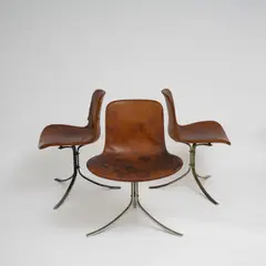 Suite de trois chaises PK9 by Poul Kjaerholm, A set of three impressed 'PK9' chairs in steel, fiberglass and leather designed by Poul Kjaerholm in 1960 and edited by , sold Nov 2025