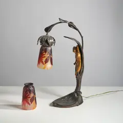 Deux tulipes by Daum Nancy, Two signed lampshades in acid-etched multilayered glass with a rotating dahlia decoration on a marble background by Daum, sold Nov 2025