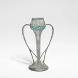Archibald Knox, for Liberty & Co., circa 1905, Pewter, of twin handled form, the sides set with enamelle cabochons