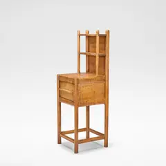 Gordon Russell, 'Stow', bedside cabinet, designed circa 1925, Cherry, the two-tiered gallery shelf over a single cupboard, the shelves with ribbed fronts, raised on octagonal supports