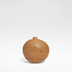Globular vase by Mary Rogers, Earthenware, dry textured body with a mottled orange glaze, sold Sep 2025