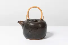 Théière by Pierre Culot, A teapot in glazed stoneware and bamboo by Pierre Culot circa 1980 with the artist's seal, sold Jan 2025