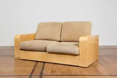 Canapé by Aldo Tura, A sofa in varnished parchment, leather, chipboard and casters by Aldo Tura circa 1960, offered Jan 2025