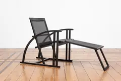 Pascal Mourgue, Fauteuil Arc et son repose-pieds, An 'Arc' armchair and its footrest in lacquered beech, cane and metal designed by Pascal Mourgue in 1983 and edited by Triconfort