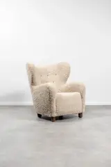 Travail Danois, Fauteuil, A Danish armchair in stained wood and wool circa 1940
