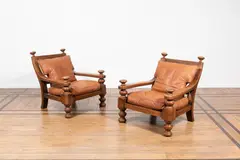 Travail Scandinave, Paire de fauteuils, A pair of Scandinavian armchairs in walnut and leather circa 1930