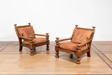 Travail Scandinave, Paire de fauteuils, A pair of Scandinavian armchairs in walnut and leather circa 1930