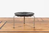 Tabouret PK33 by Poul Kjaerholm, An impressed 'PK33' stool in polished steel, lacquered wood and leather designed by Poul Kjaerholm in 1958 and edited by, sold Jan 2025