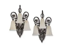 Pair of fer forgé appliques by Edgar Brandt, circa 1925, Wrought iron, each modelled as a flower basket, offered Dec 2024