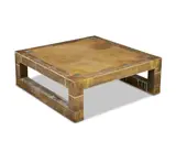 Rodolfo Dubarry, Coffee table, circa 1970, Brass mounted with pewter inlay, the edges with hammered decoration, raised on sledge supports