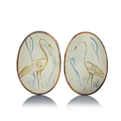 Two dishes by Michael Cardew, circa 1975, Stoneware, cream glaze with blue and iron brushed design, offered Dec 2024