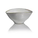 Squeezed bowl by Lucie Rie, circa 1957, Stoneware, white glaze with feathered manganese rim, sold Dec 2024