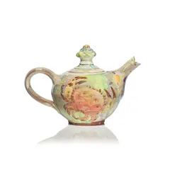 Maureen Minchin, Teapot, circa 2000, Glazed earthenware, decorated in polychrome with motifs of otters and crabs